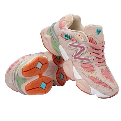 Pair of pastel-colored sneakers on a light gray background